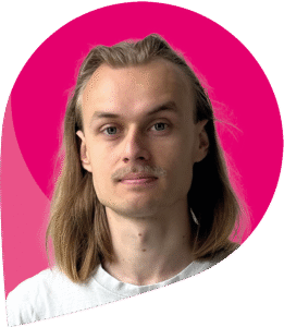 zfm-Teammitglied Sebastian Seifert vor pinken Hintergrund (umgekehrter zum-Tropfen)